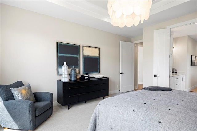 bedroom featuring a chandelier, baseboards, and light carpet