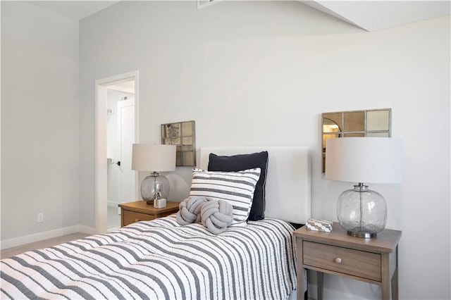 bedroom featuring baseboards and carpet flooring