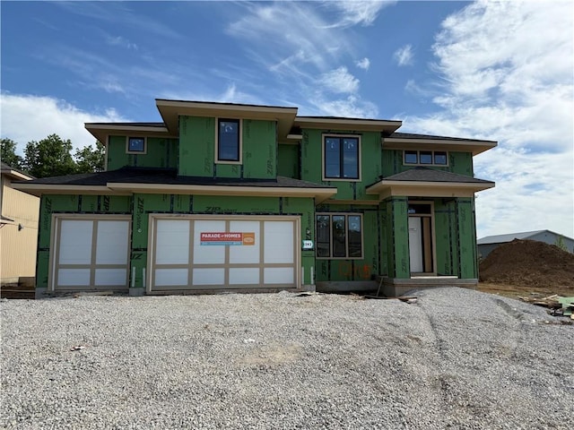 view of front of property featuring an attached garage and driveway