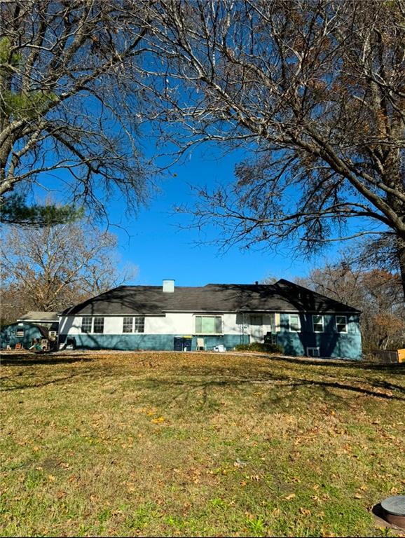 view of home's exterior with a yard