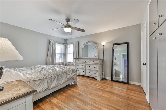 bedroom featuring ceiling fan and light hardwood / wood-style floors