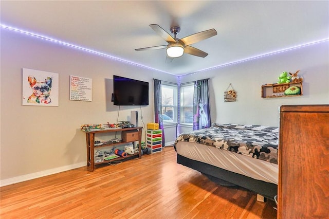 bedroom with hardwood / wood-style flooring and ceiling fan