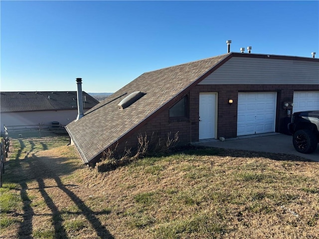 view of front of house with a garage and a front lawn