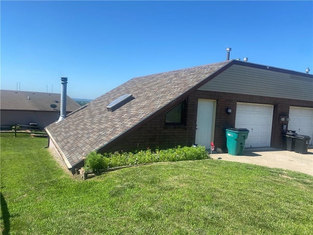 view of side of home featuring a garage and a yard