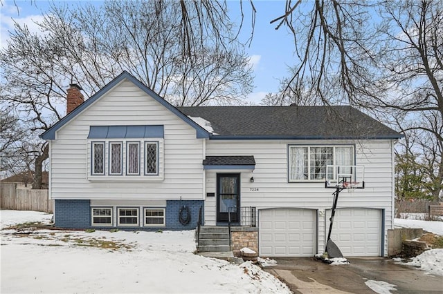 split foyer home featuring a garage