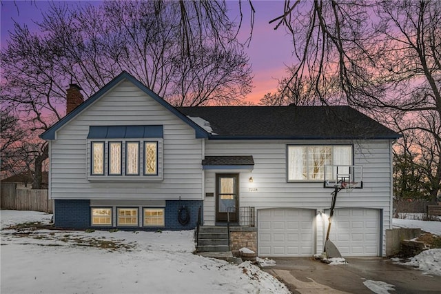 bi-level home featuring a garage