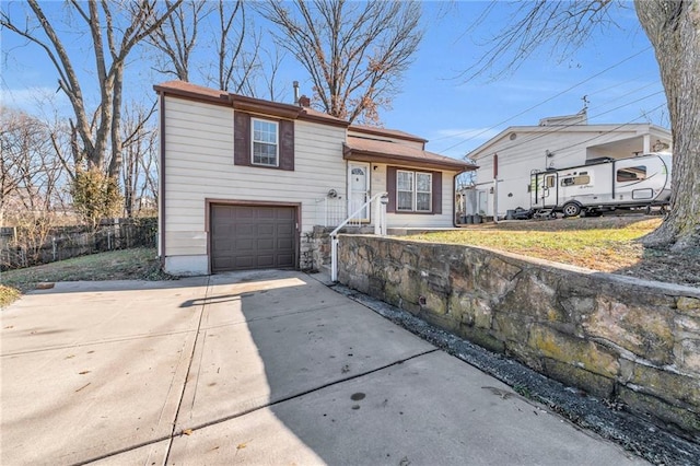 view of front of property with a garage