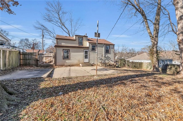 back of house with a patio area