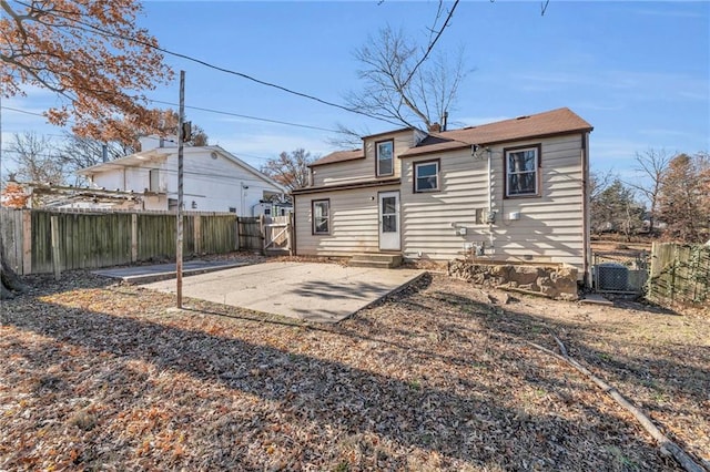 back of property featuring cooling unit and a patio area