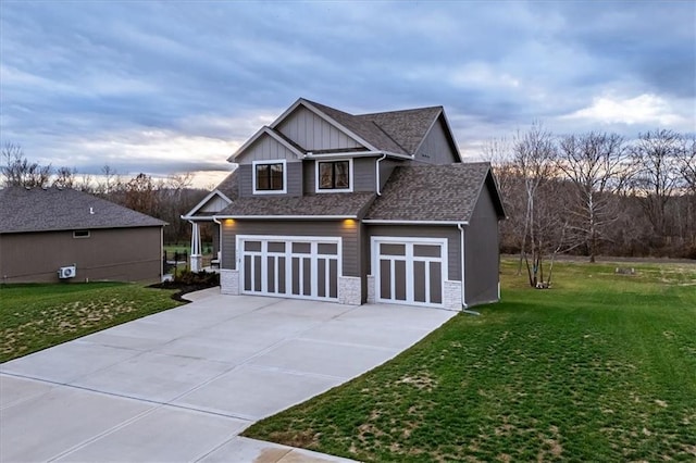 view of front of property with a garage and a front lawn