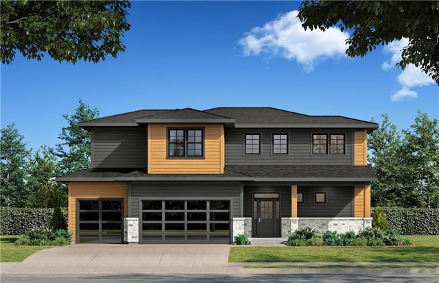 view of front of property featuring a front lawn and a garage