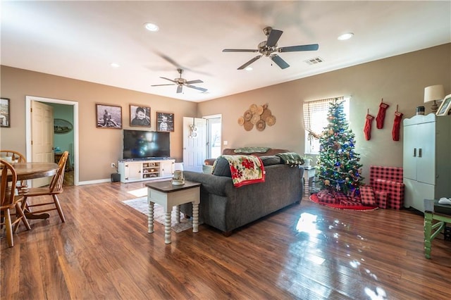 living room with ceiling fan and hardwood / wood-style flooring