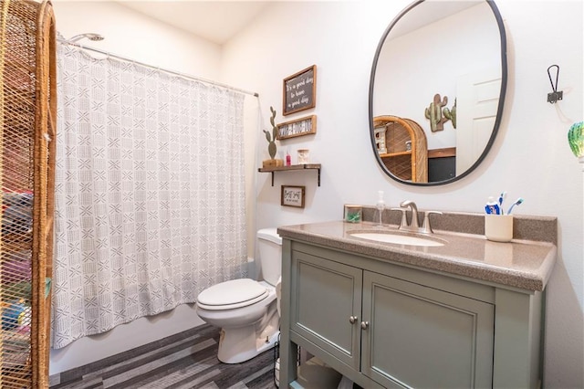 full bathroom with hardwood / wood-style flooring, vanity, toilet, and shower / tub combo with curtain