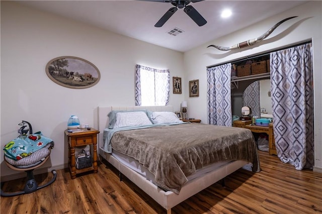 bedroom featuring dark hardwood / wood-style floors and ceiling fan