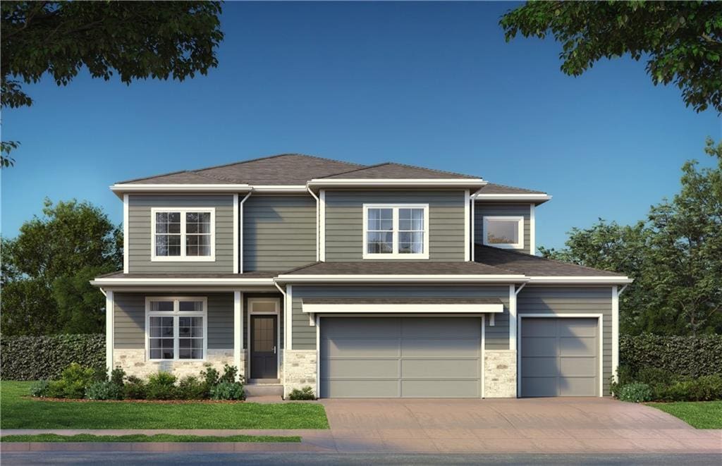 view of front facade with a front yard and a garage