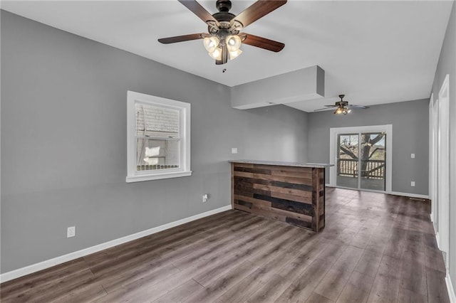 interior space with ceiling fan and hardwood / wood-style flooring