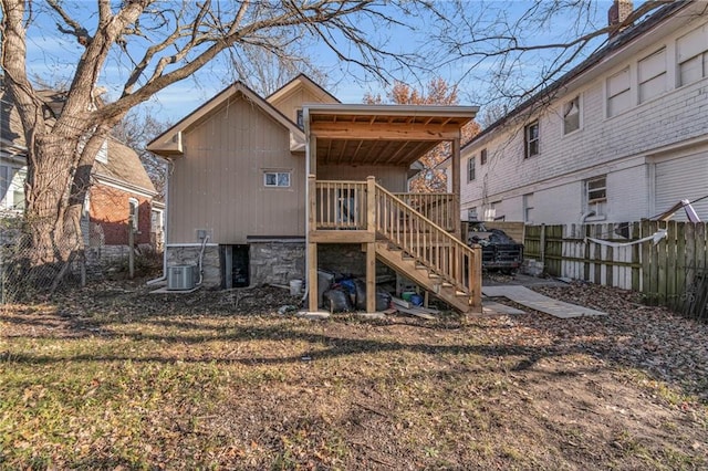 rear view of property featuring cooling unit