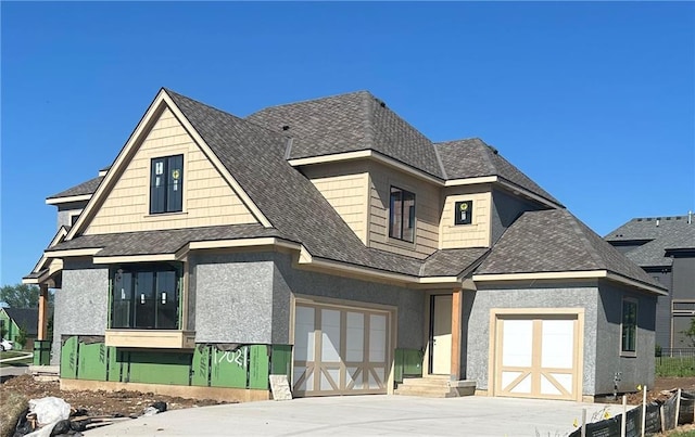 17021 King St, Overland Park, KS 66221 - view of front of home featuring driveway, an attached garage, and roof with shingles