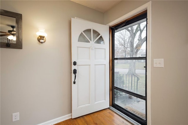 foyer featuring ceiling fan and light hardwood / wood-style flooring