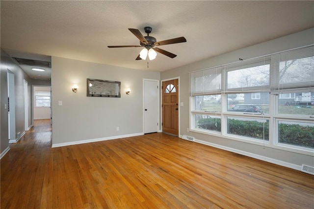 spare room featuring ceiling fan and hardwood / wood-style floors