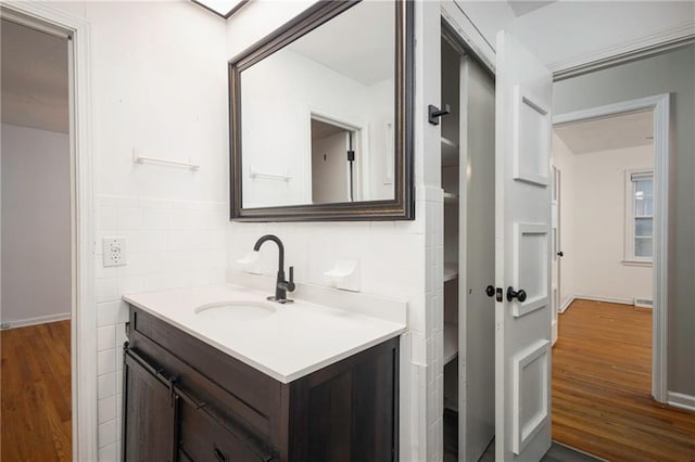 bathroom with vanity and wood-type flooring