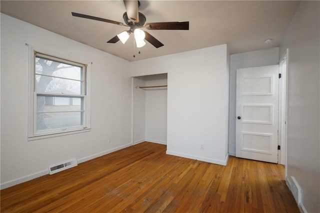 unfurnished bedroom with light hardwood / wood-style floors, a closet, and ceiling fan