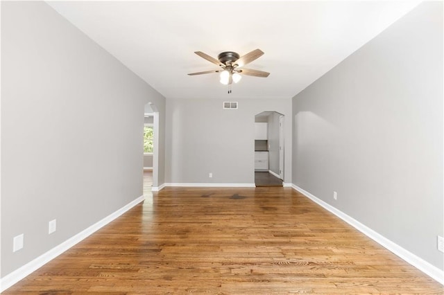 unfurnished living room with ceiling fan and light hardwood / wood-style floors