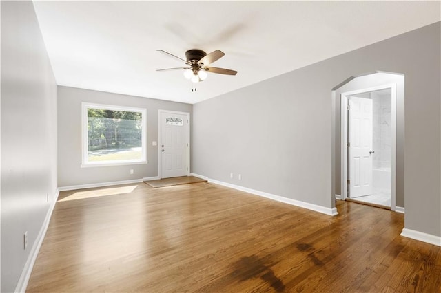 spare room with wood-type flooring and ceiling fan