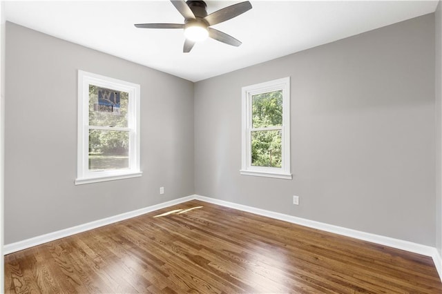 unfurnished room with hardwood / wood-style flooring and ceiling fan