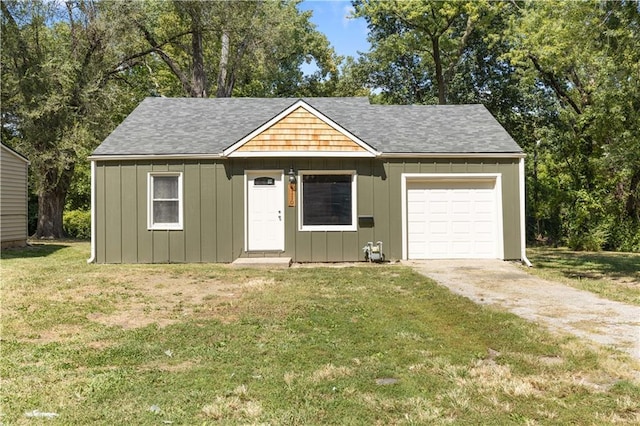 ranch-style home with a garage and a front lawn