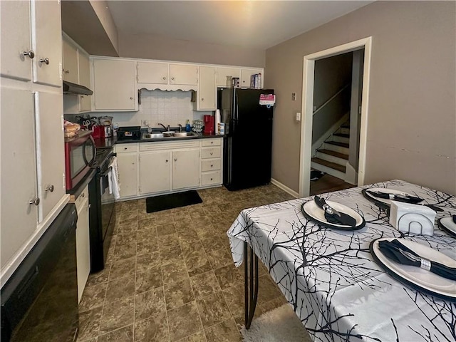 kitchen with sink, white cabinets, decorative backsplash, exhaust hood, and black appliances