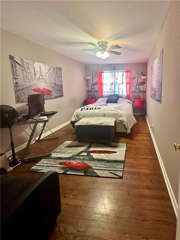 bedroom featuring ceiling fan and dark wood-type flooring