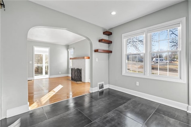 living room featuring dark hardwood / wood-style floors and a fireplace