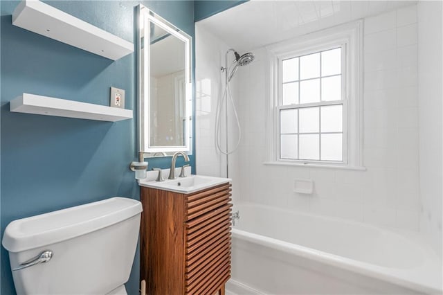 full bathroom featuring vanity, toilet, and tiled shower / bath