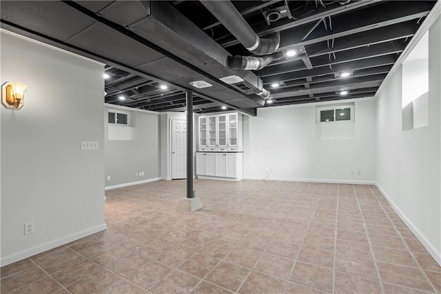 basement with tile patterned floors