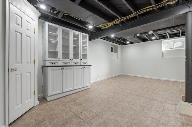 basement featuring light tile patterned flooring