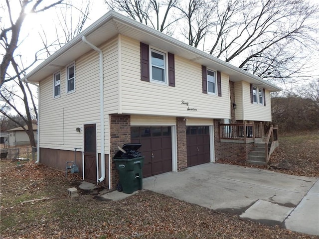 view of side of property with a garage