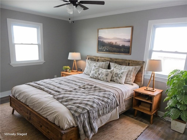 bedroom with multiple windows, ceiling fan, dark hardwood / wood-style floors, and ornamental molding