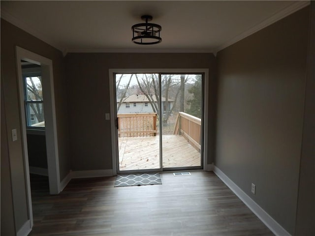 entryway featuring dark wood-type flooring and ornamental molding