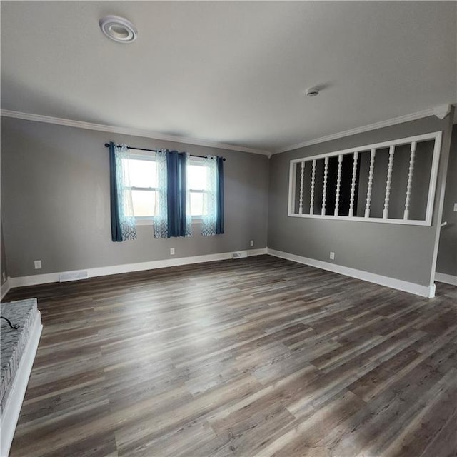 unfurnished room with crown molding and dark wood-type flooring