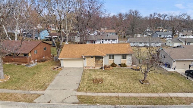 view of front facade with a garage, a residential view, concrete driveway, and a front lawn