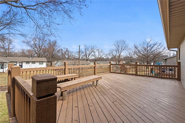 wooden terrace with a residential view