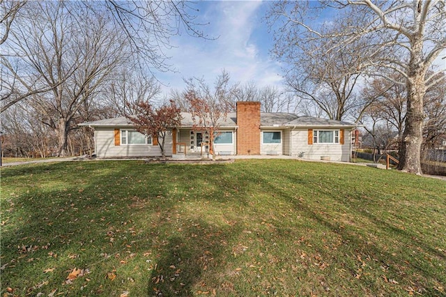 ranch-style home with a front yard