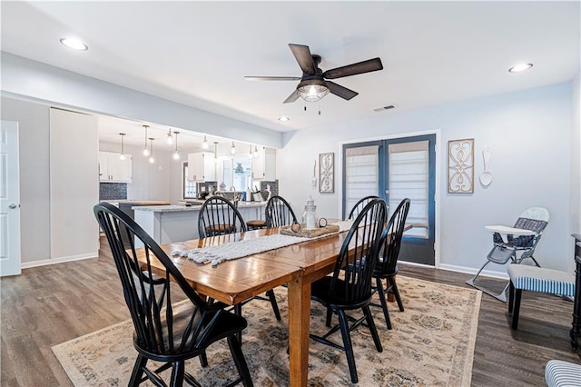 dining area featuring hardwood / wood-style flooring, ceiling fan, and french doors