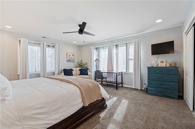 bedroom with light carpet, a closet, and ceiling fan