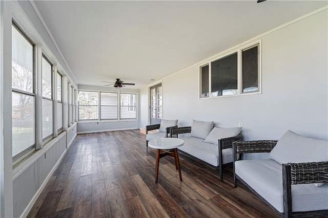 sunroom / solarium featuring ceiling fan