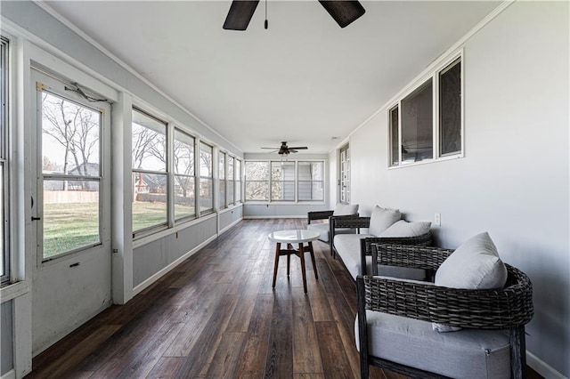 sunroom featuring ceiling fan