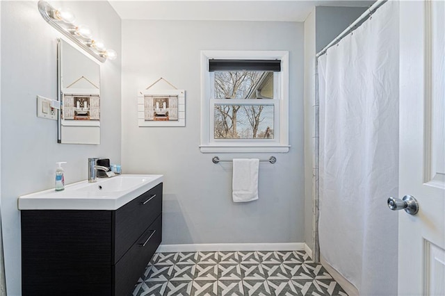 bathroom with tile patterned floors and vanity