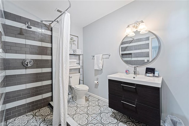 bathroom with vanity, tile patterned flooring, a shower with curtain, and toilet