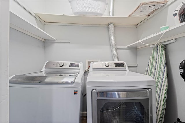 laundry area with washing machine and dryer